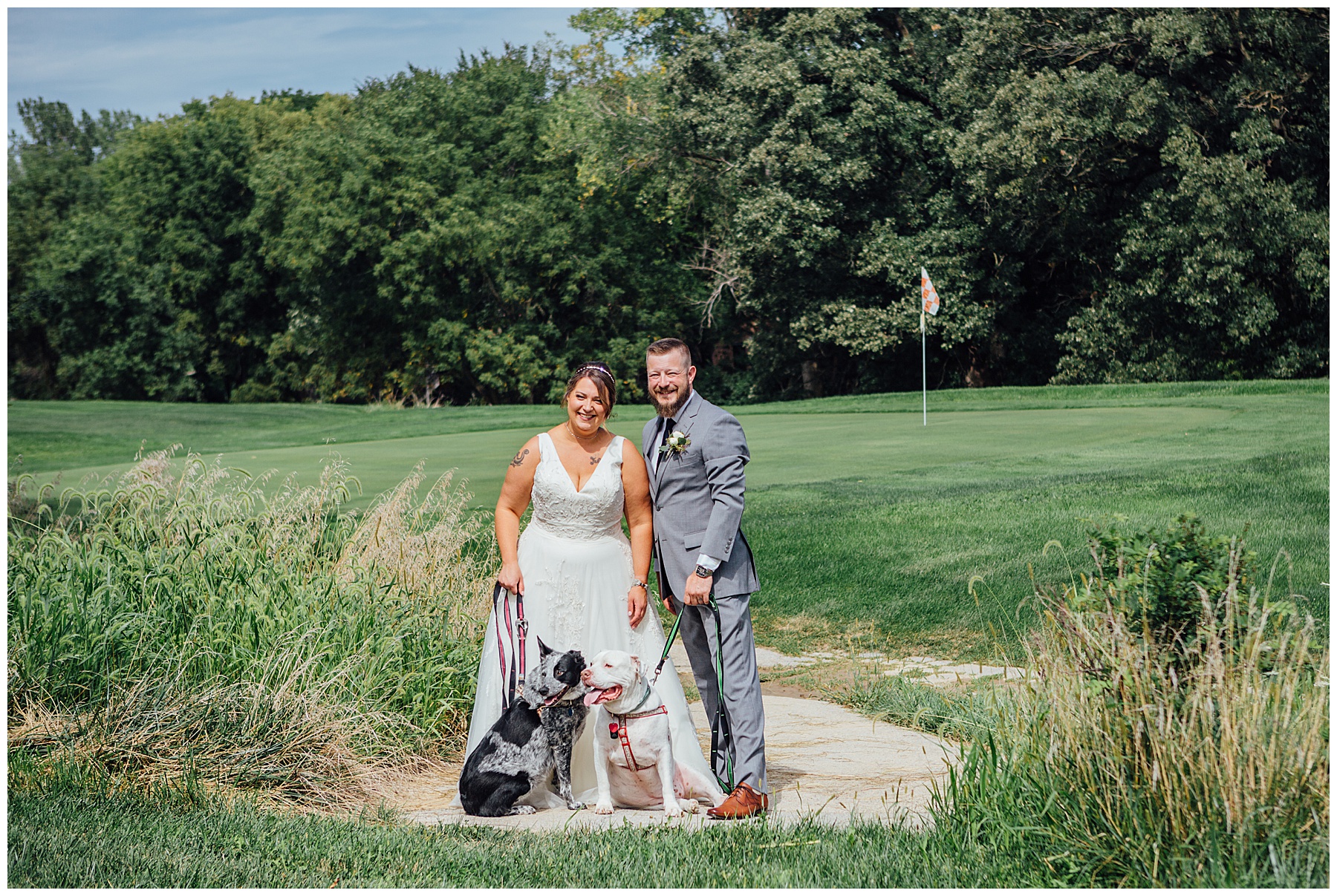 Bride and groom with dogs