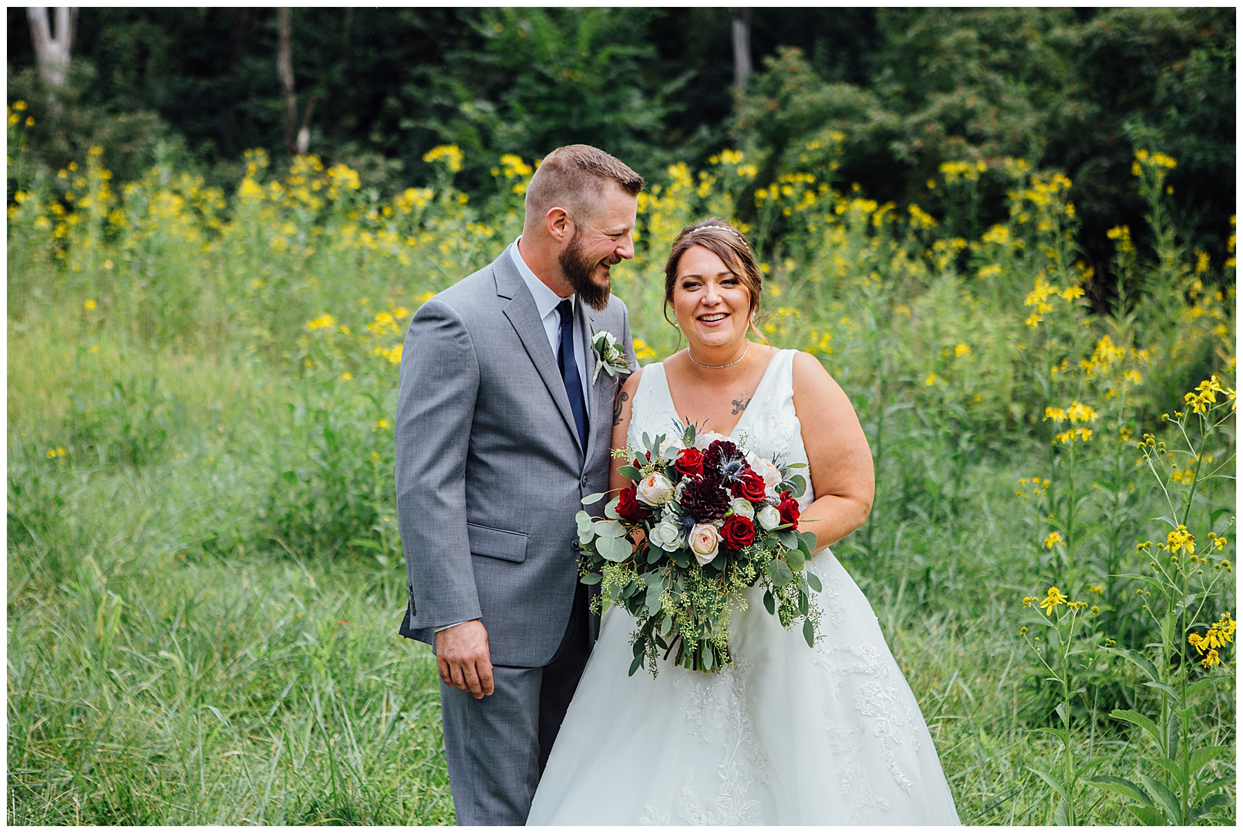 Bride and groom in a field