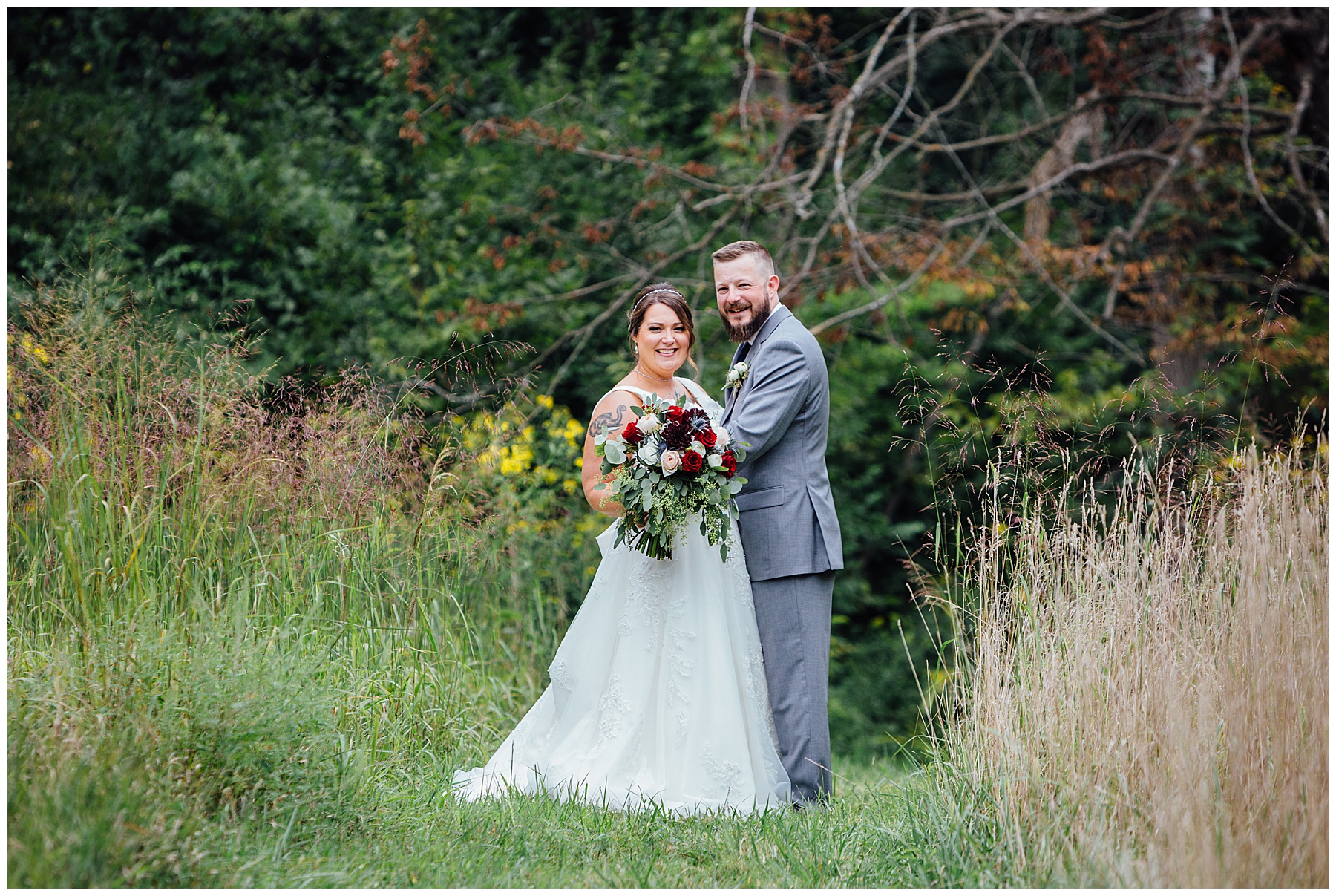 Bride and groom on a path in field