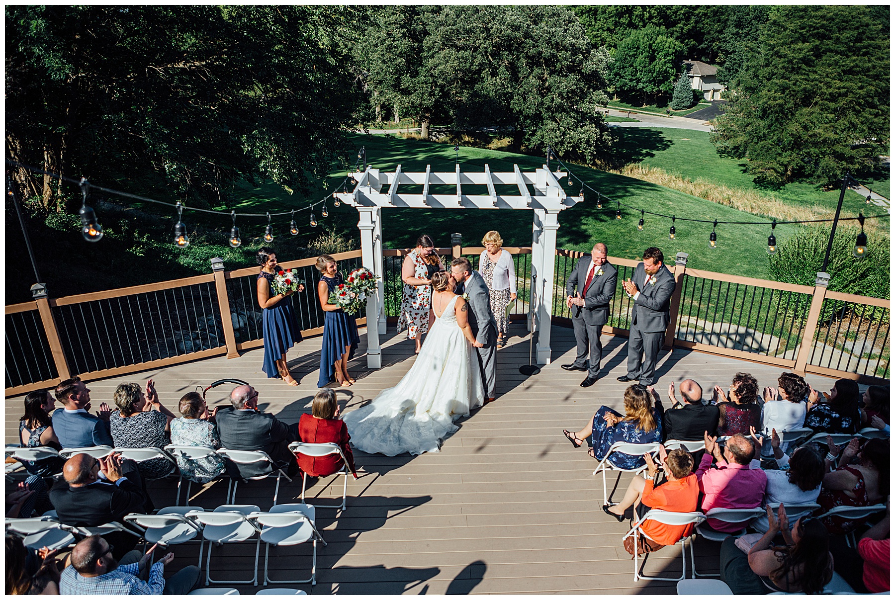 First kiss during wedding at A view at Fontenelle Hills