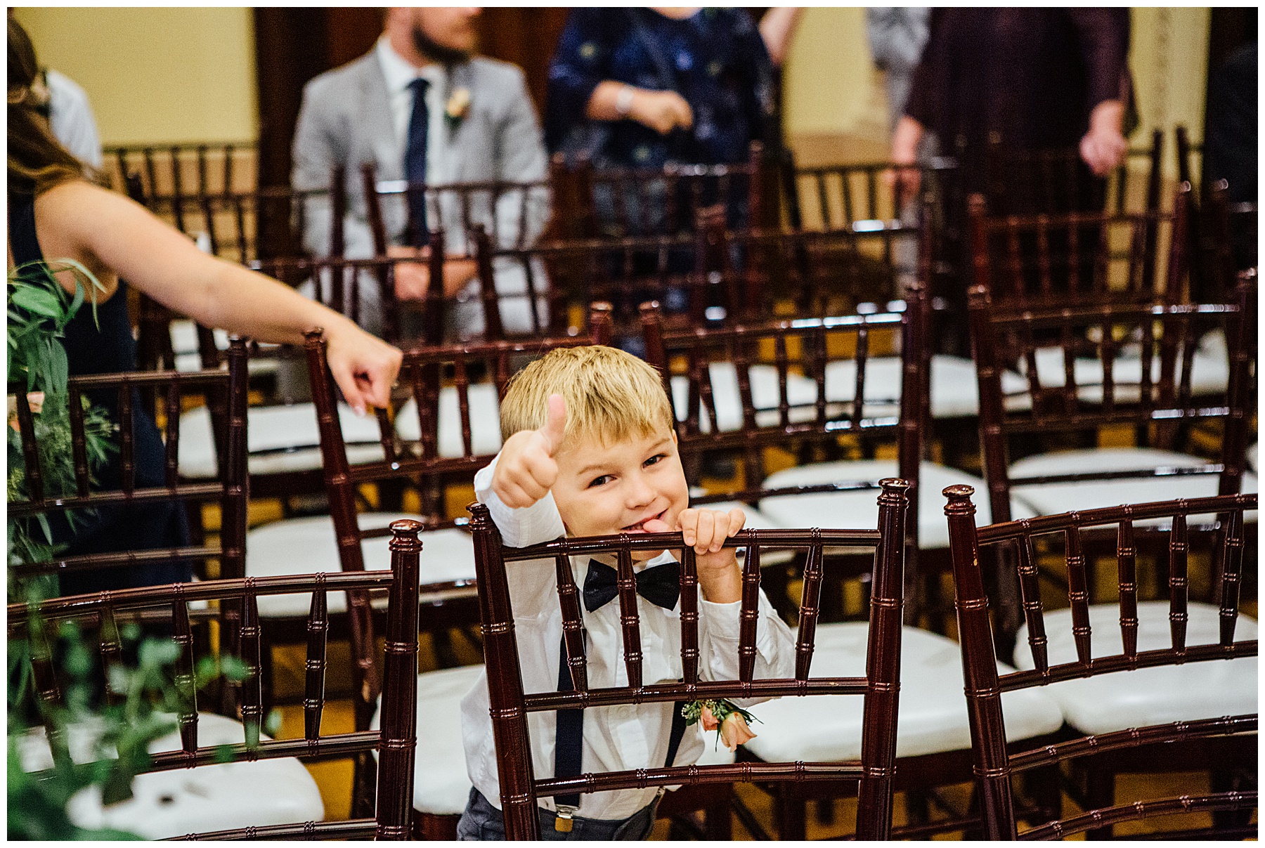 Boy giving thumbs up.