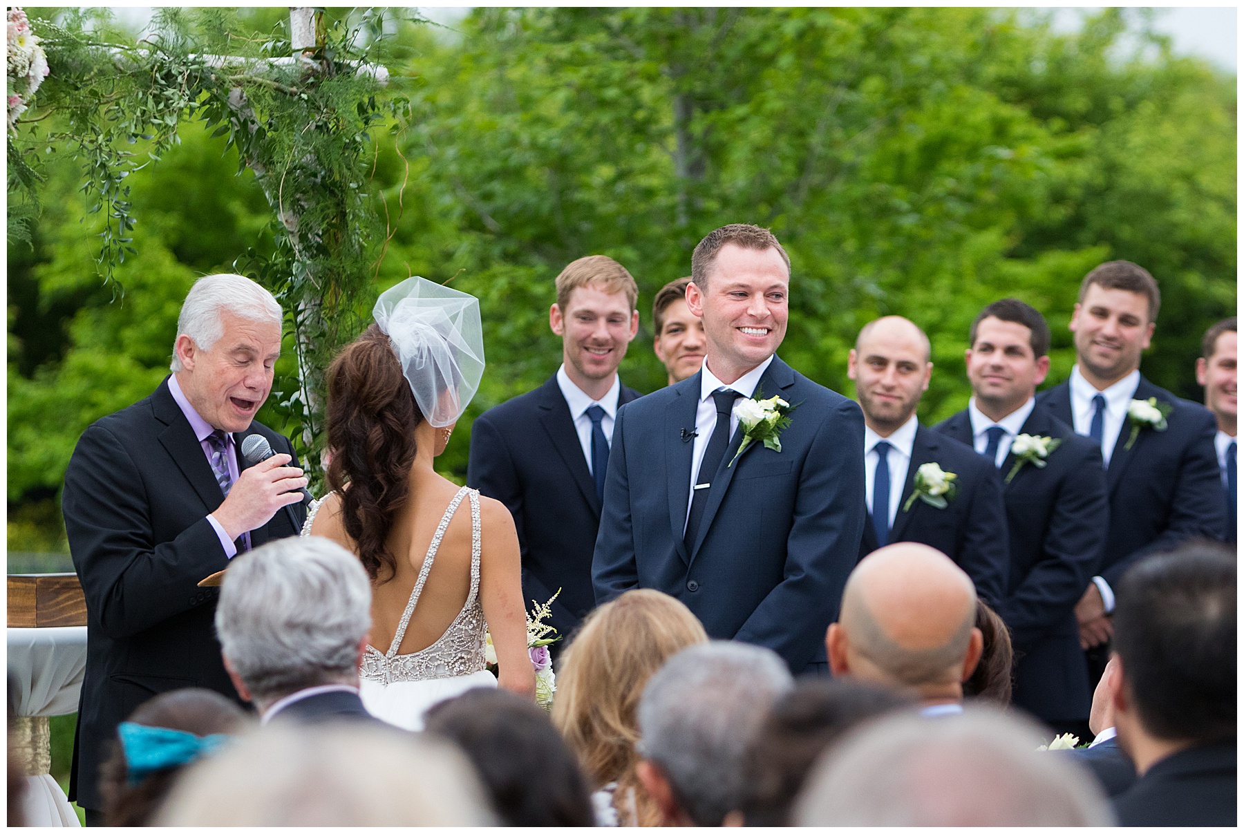 Groom smiling during ceremony