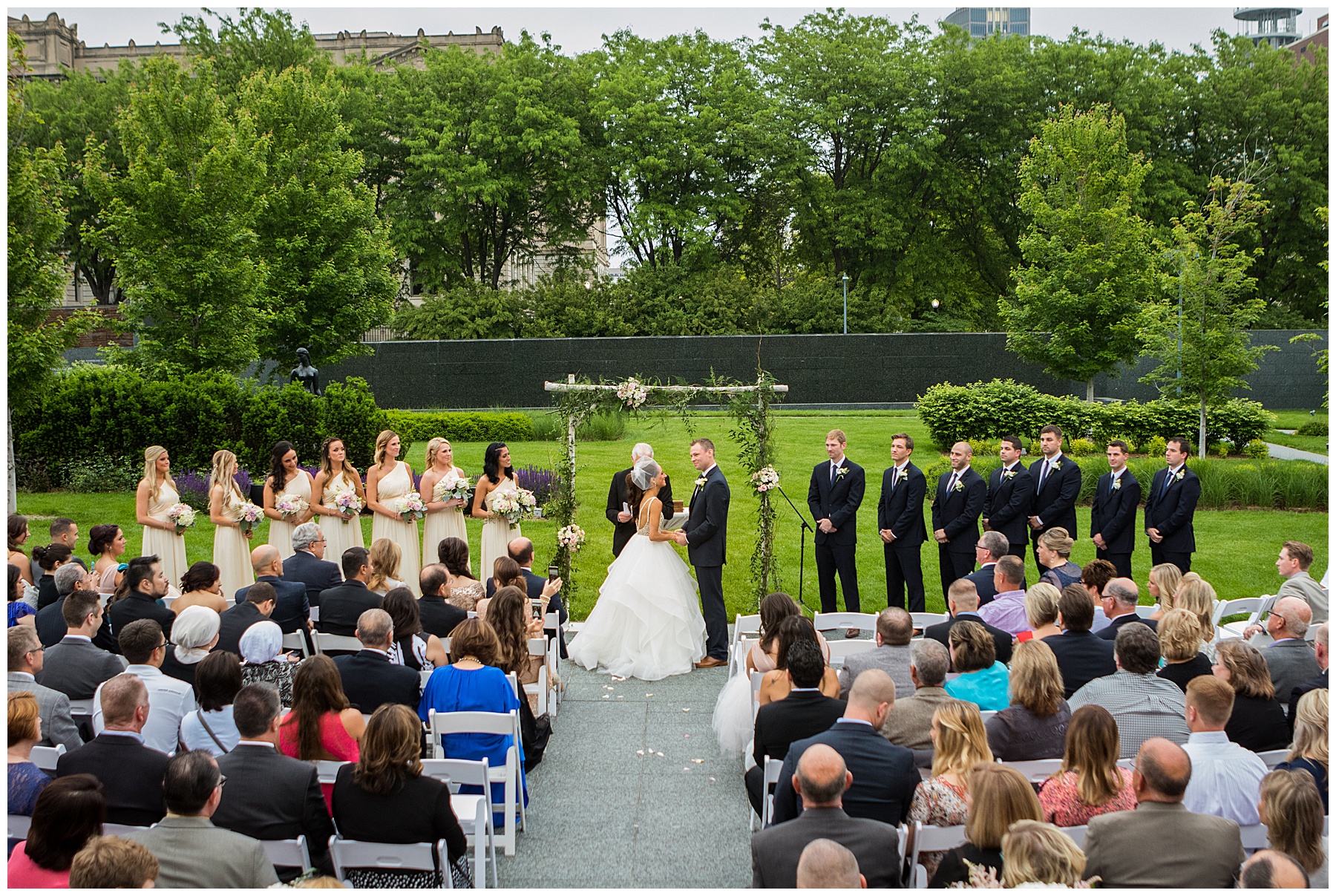 Outdoor wedding at Josyln Art Museum,Andrea Bibeault: a wedding photojournalist specializes in real,photojournalistic wedding photography. Based in Omaha,we travel all over the midwest and country.,