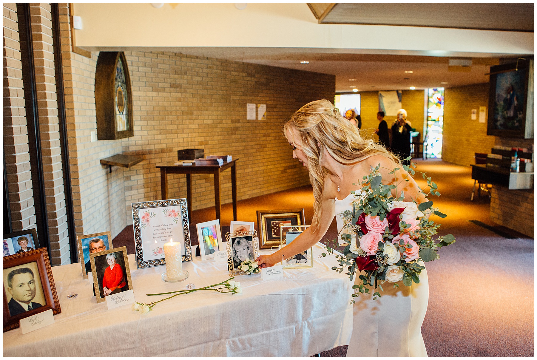 Bride placing flowers in memory of her late mother at Lutheran Church of the Master Wedding