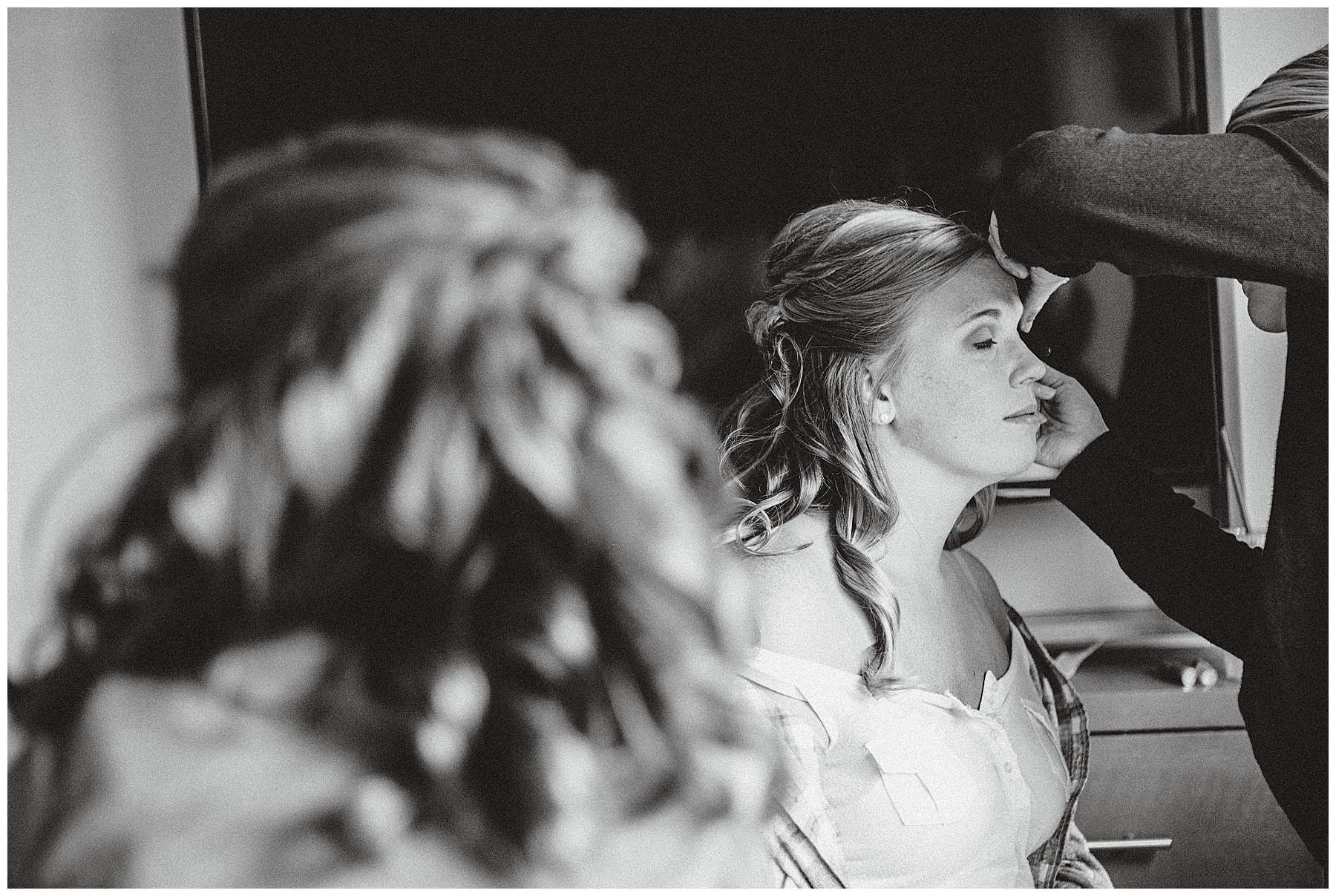 Bride doing makeup at Simply Ballroom wedding photos