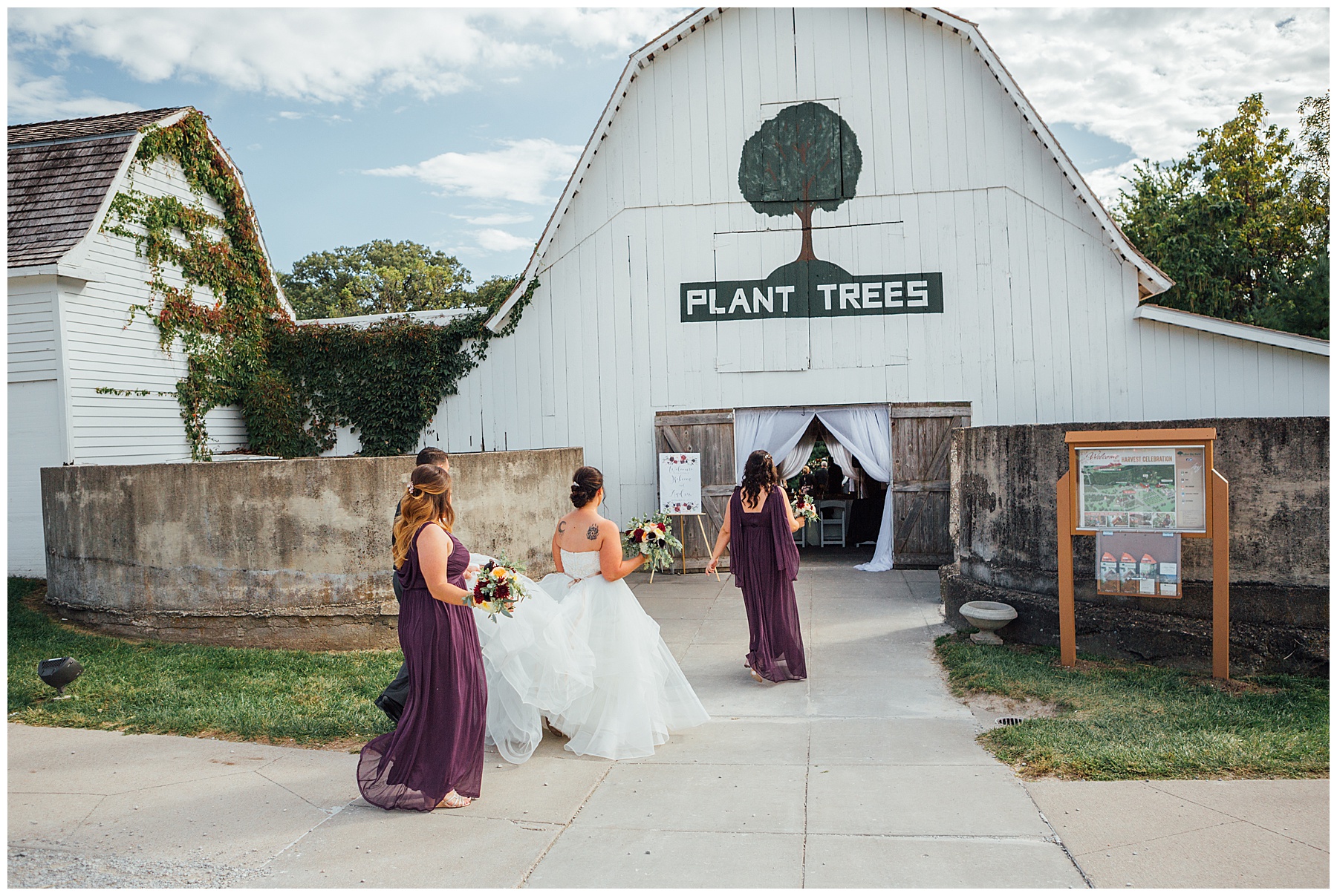 Bride walking into a barn for wedding