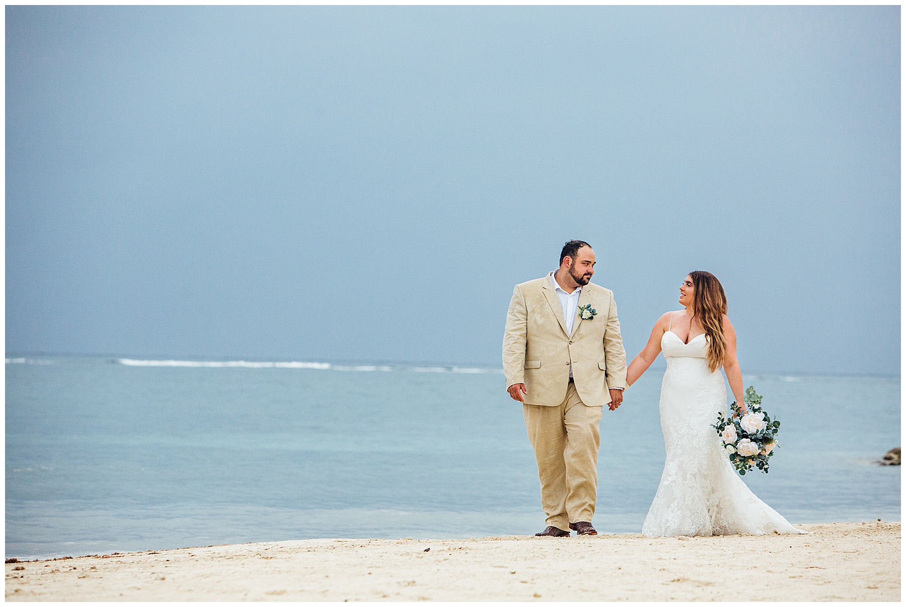 Bride and Groom walking on beach in Jamaica