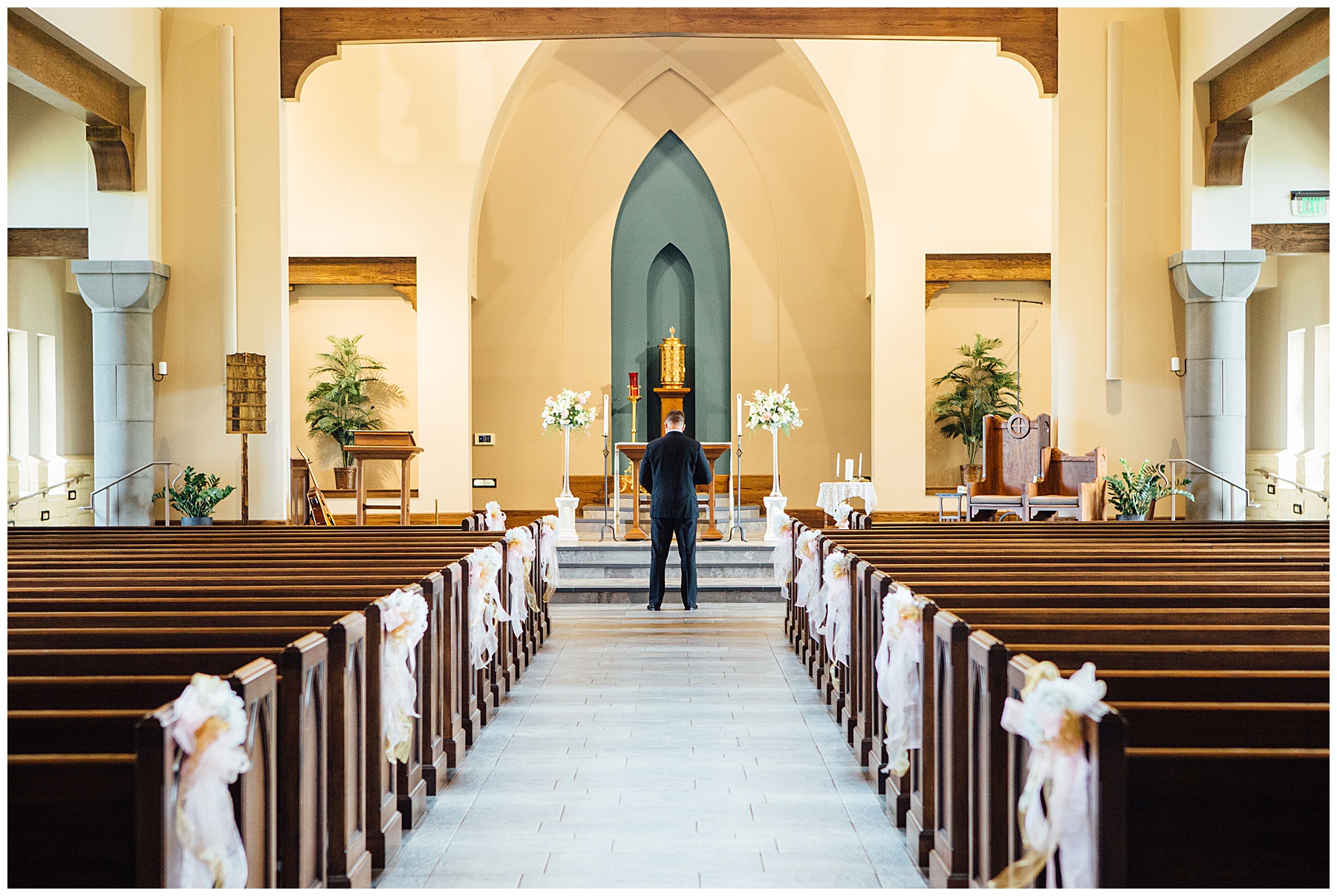 Groom standing alone in church