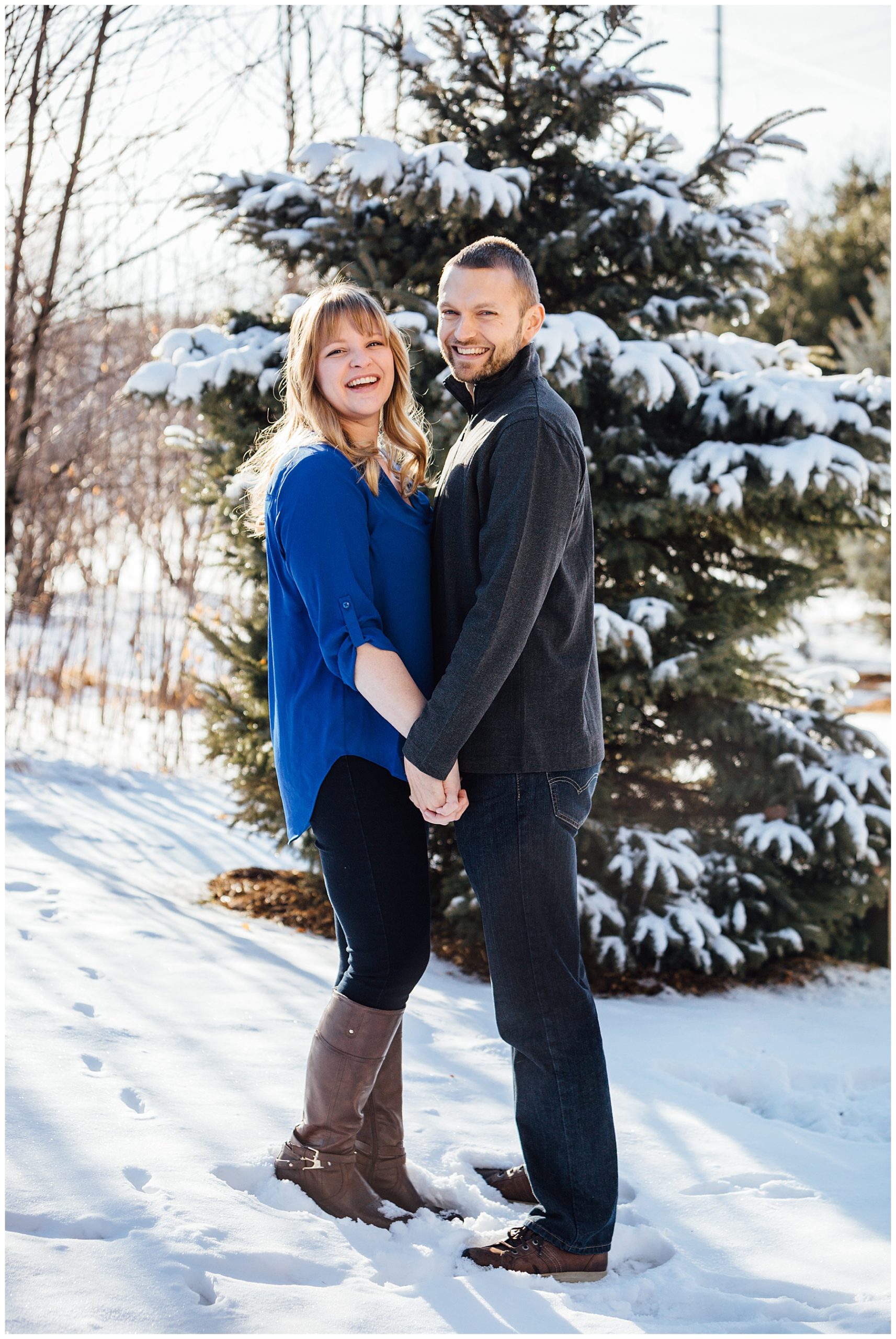 Engagement photo with snow on the ground.