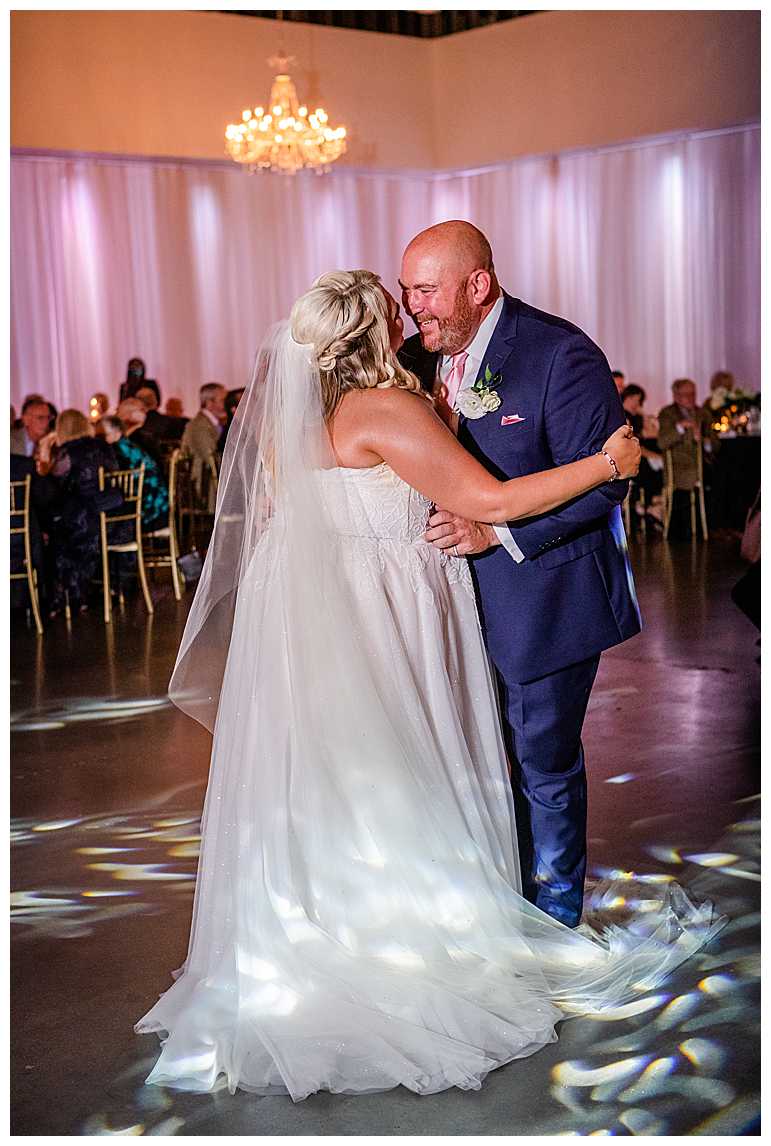 Bride and Groom dancing at Omaha Design Center